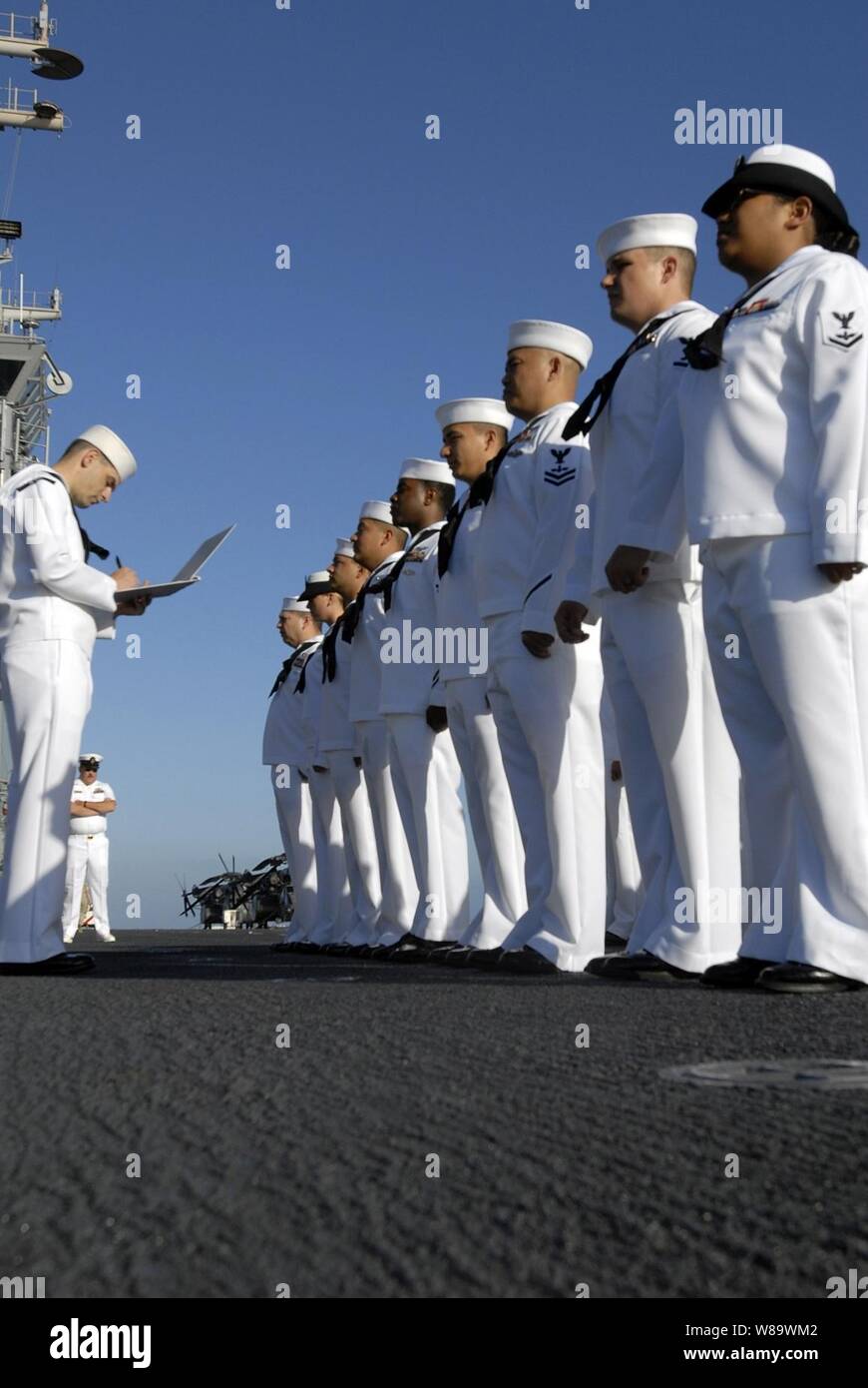 U.S. Navy sailors from the weapons department aboard the USS Boxer (LHD 4) stand in formation during a uniform inspection aboard the ship on May 2, 2008.  The Boxer is deployed in support of Continuing Promise 2008, a two-month humanitarian civic assistance mission to South America. Stock Photo