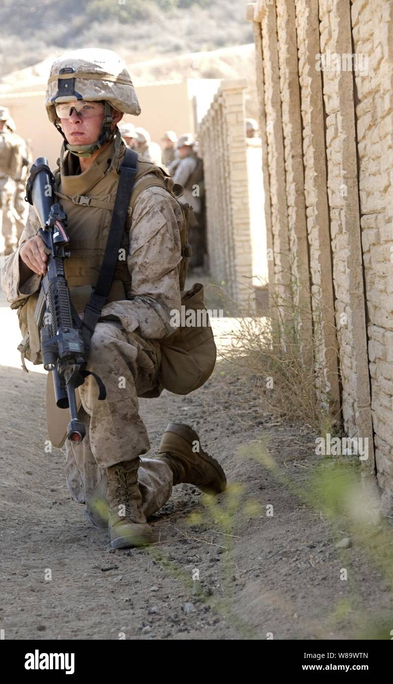 A U.S. Marine from Echo Company, 2nd Battalion, 1st Marine Regiment participates in an exercise at the simulated town, called combat town, at Camp Pendleton, Calif., on Aug. 12, 2008.  The exercise helps Marines prepare for real-world combat situations. Stock Photo