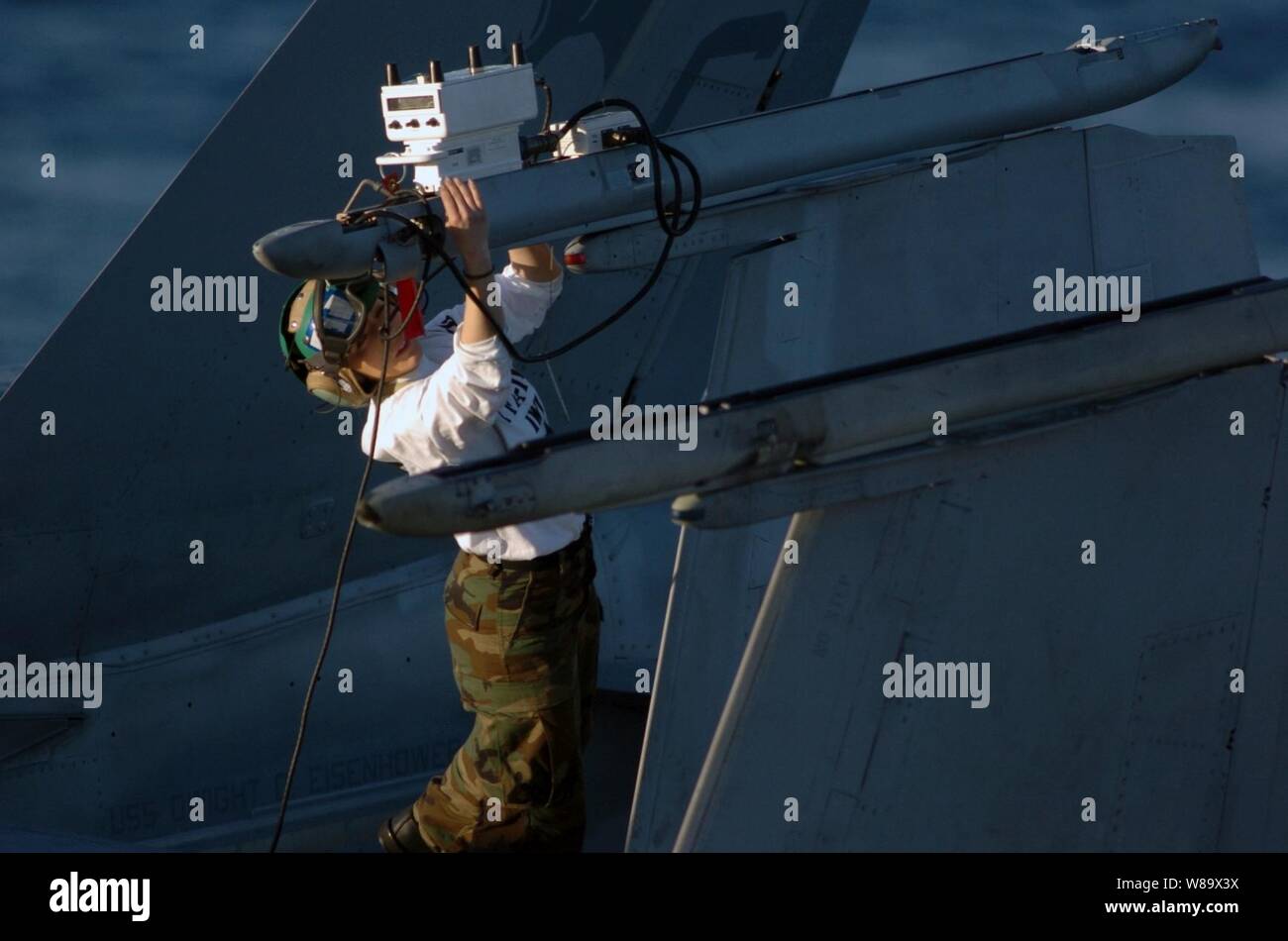 U.S. Navy Petty Officer 2nd Class Kimberly Clark performs a weapons system release and control check on an F/A-18C Hornet aircraft on the flight deck of the aircraft carrier USS Dwight D. Eisenhower (CVN 69) underway in the Atlantic Ocean on Jan. 10, 2009.  Military personnel aboard the ship are participating in a composite unit training exercise that tests a Navy Carrier Strike Group's capabilities before it is deployed. Stock Photo