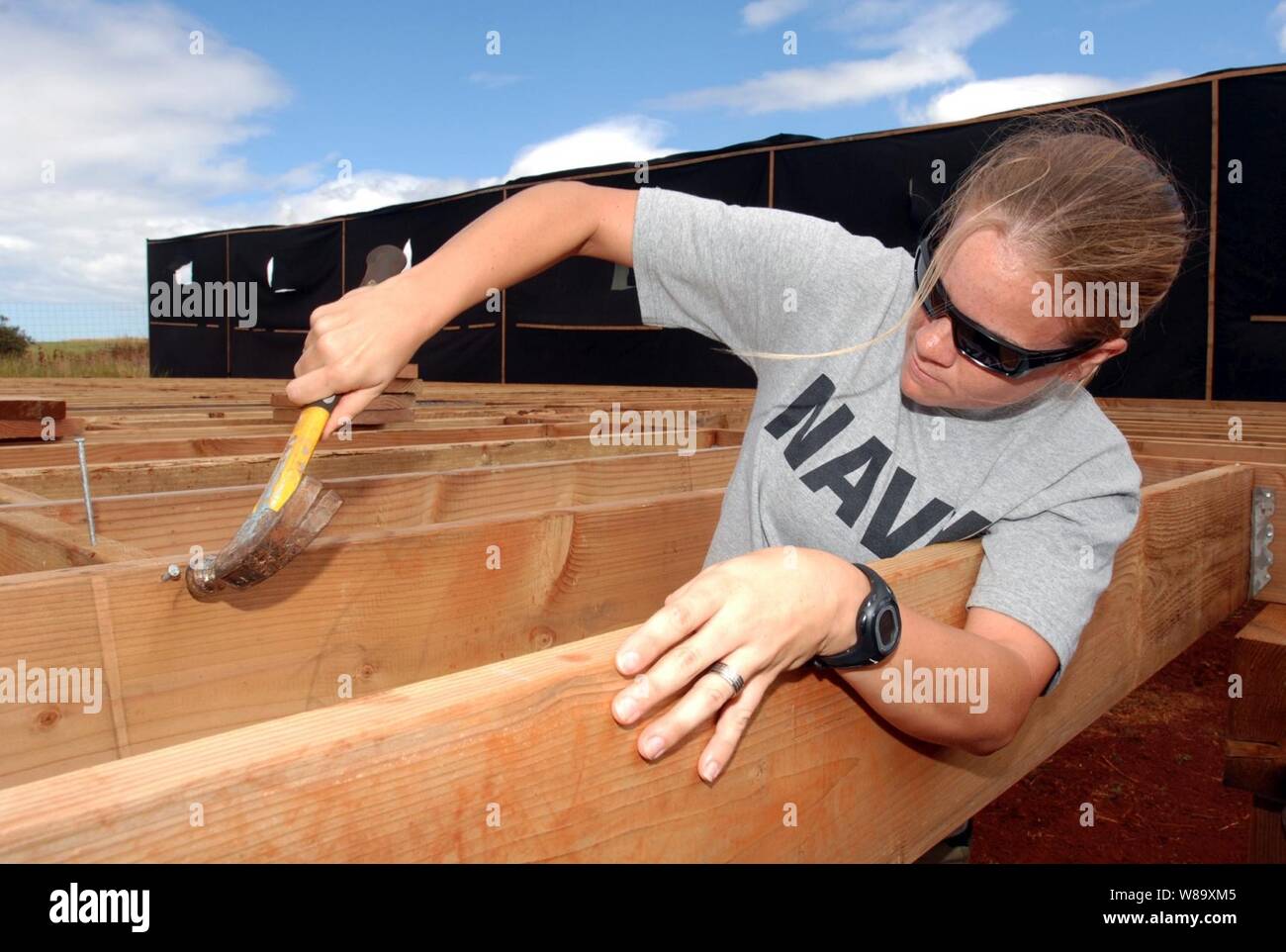 U.S. Navy Petty Officer 2nd Class Mehgan Rodriguez works on a deck for