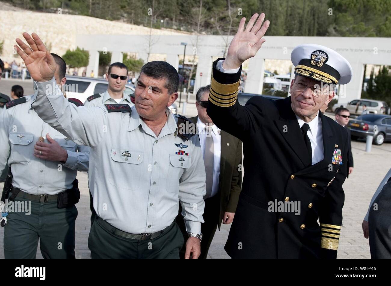 Chief of Defense Israeli Defense Force Lt. Gen. Gabi Ashkenazi and Chairman of the Joint Chiefs of Staff Adm. Mike Mullen, U.S. Navy, wave to onlookers at the Yad Ve Shem Holocaust Memorial Museum in Jerusalem, Israel, on Feb. 15, 2010.  Mullen is on a weeklong tour of the region visiting with key partners and allies. Stock Photo