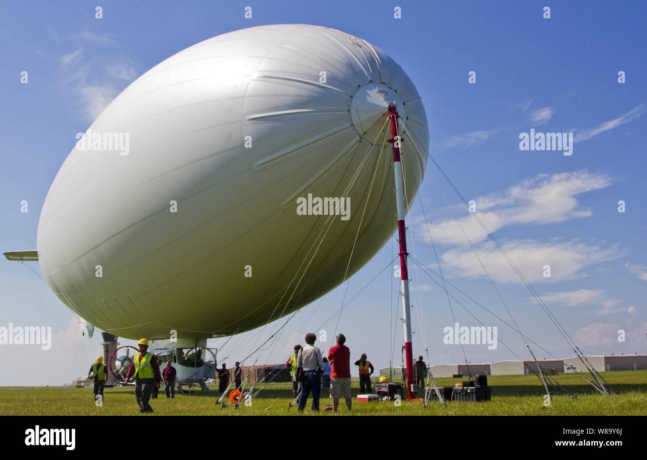 A U.S. Navy MZ-3A manned airship, Advanced Airship Flying Laboratory, derived from the commercial A-170 series blimp, lands at Lake Front Airport in New Orleans, La., to provide logistical support for the Deepwater Horizon Response Unified Command and the Gulf of Mexico oil spill on July 8, 2010.  The Coast Guard requested the support of the Navy vehicle to help detect oil, direct skimming vessels and look for wildlife that may be threatened by oil. Stock Photo