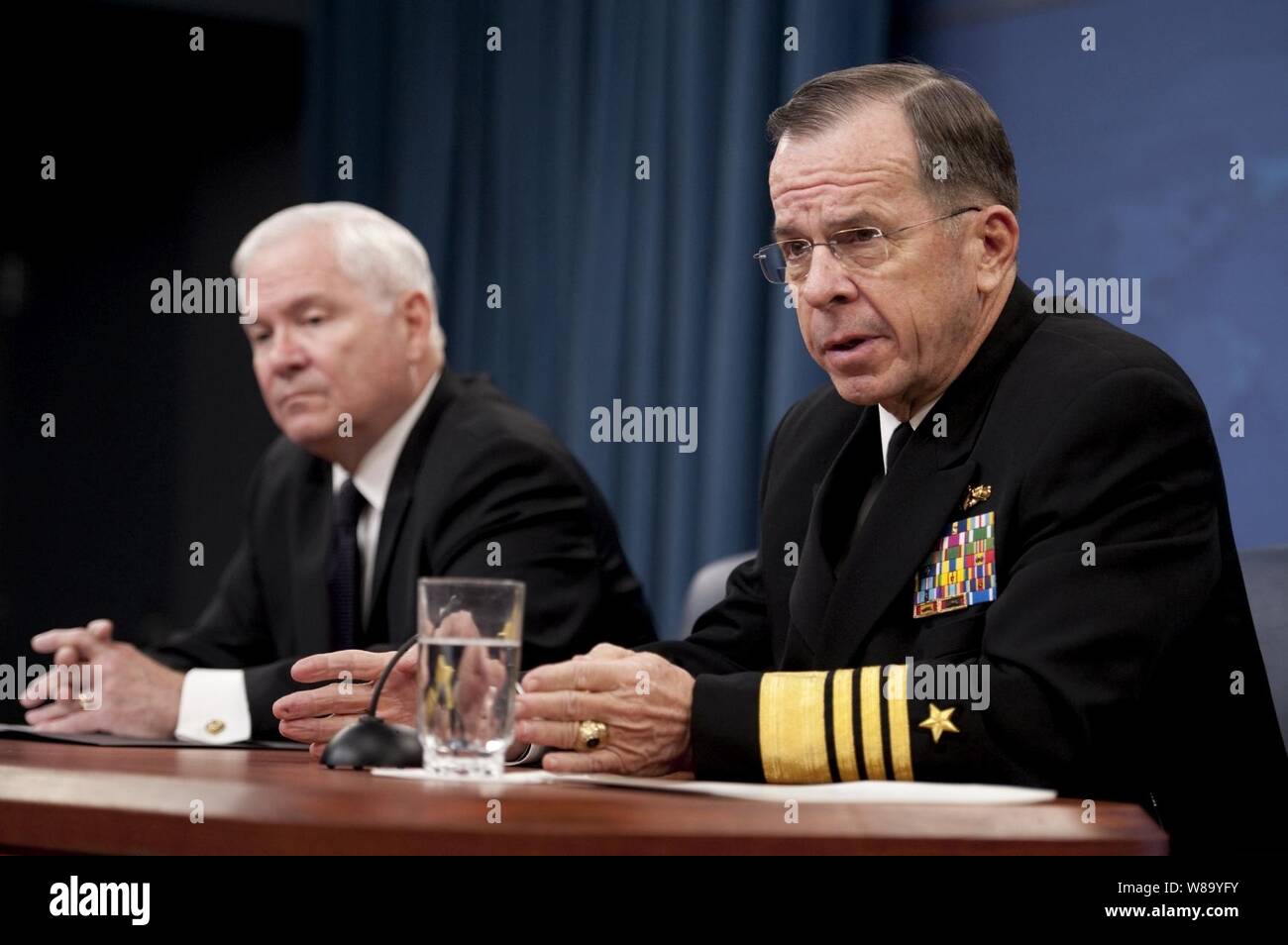 Secretary of Defense Robert M. Gates and Chairman of the Joint Chiefs of Staff Adm. Mike Mullen, U.S. Navy, conduct a press briefing in the Pentagon discussing the public release of the 'Don?t Ask, Don?t Tell' Comprehensive Working Group report on Nov. 30, 2010. Stock Photo