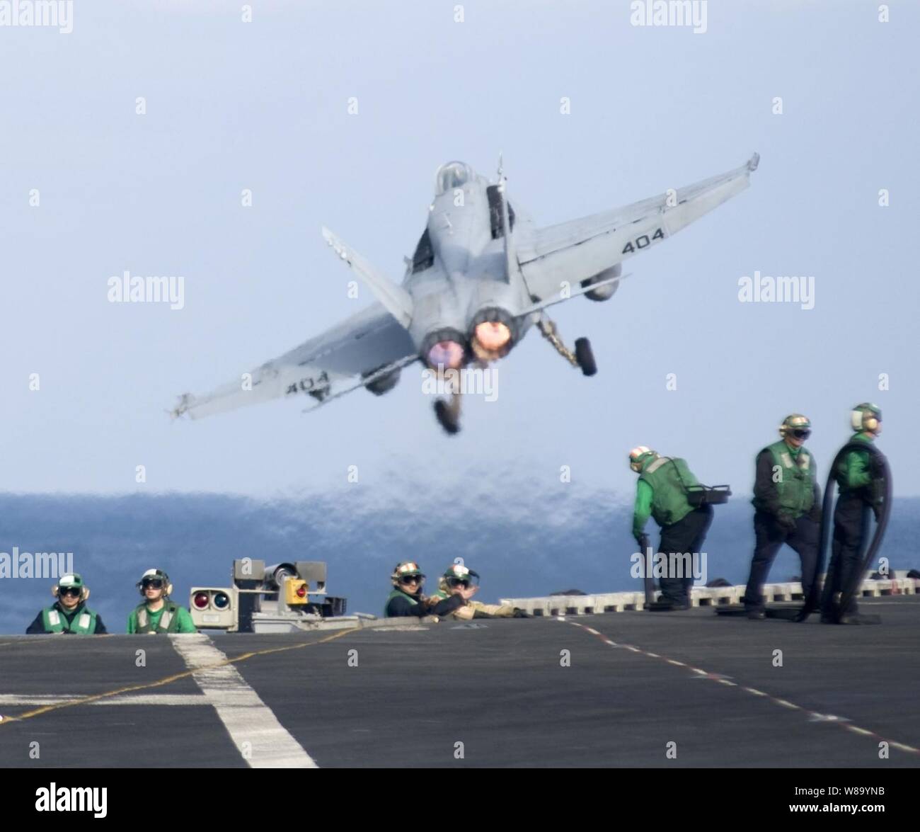 A U.S. Navy F/A-18C Hornet assigned to Strike Fighter squadron 25 launches from the flight deck of the aircraft carrier USS Carl Vinson (CVN 70) in the Pacific Ocean on Jan. 8, 2011.  The Carl Vinson and Carrier Air Wing 17 went on deployment to the U.S. 7th Fleet areas of responsibility. Stock Photo