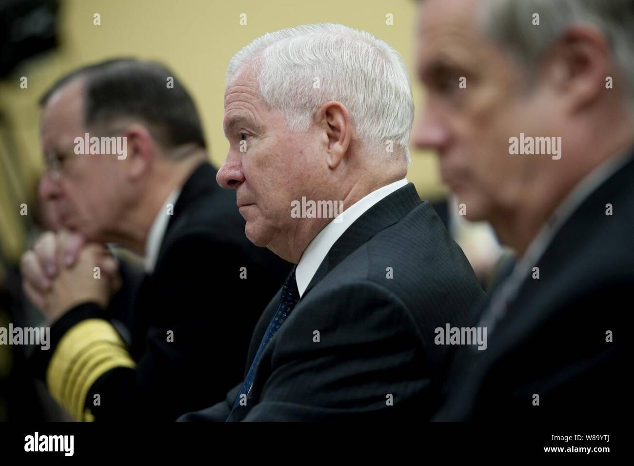 Chairman of the Joint Chiefs of Staff Adm. Mike Mullen (left), Secretary of Defense Robert M. Gates and Under Secretary of Defense for Comptroller Robert Hale testify at a hearing of the House Appropriations Committee on the fiscal 2012 budget at the Rayburn House Office Building in Washington, D.C., on March 3, 2011. Stock Photo