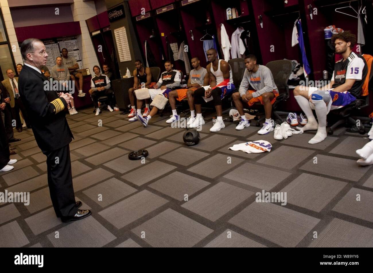 Chairman of the Joint Chiefs of Staff Adm. Mike Mullen, U.S. Navy, speaks with members of the Phoenix Suns basketball team at Sun Stadium in Phoenix, Ariz., on March 10, 2010.  Mullen visited Phoenix to speak with Arizona local and state officials in his continuing Conversations with the Country tour. Stock Photo