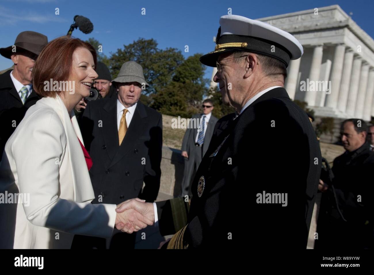 Chairman of the Joint Chiefs of Staff Adm. Mike Mullen, U.S. Navy, greets Australian Prime Minister Julia Gillard at a ceremony on the steps of the Lincoln Memorial in Washington, D.C., on March 7, 2011.  The ceremony announced the donation of $3.3 million by the Australian government to help fund the 'Education Center at the Wall' that would be located near the Vietnam Veterans? Memorial. Stock Photo