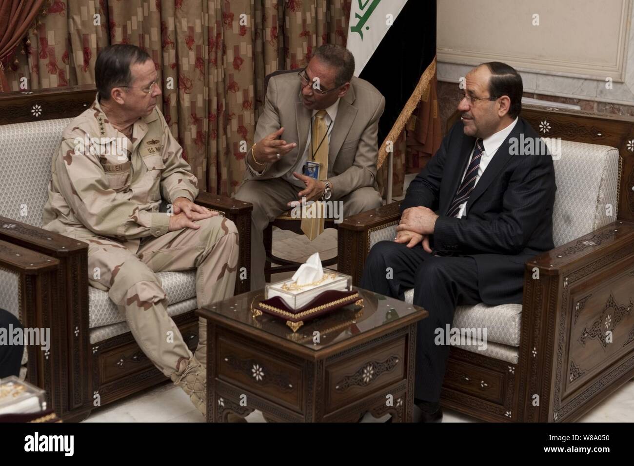 Chairman of the Joint Chiefs of Staff Adm. Mike Mullen meets with Iraqi Prime Minister Nouri al-Maliki in Baghdad, Iraq, on April 21, 2011.  Mullen is in the Central Command area of operation supporting a USO tour to the region and talking to counterparts and service members stationed in the area. Stock Photo