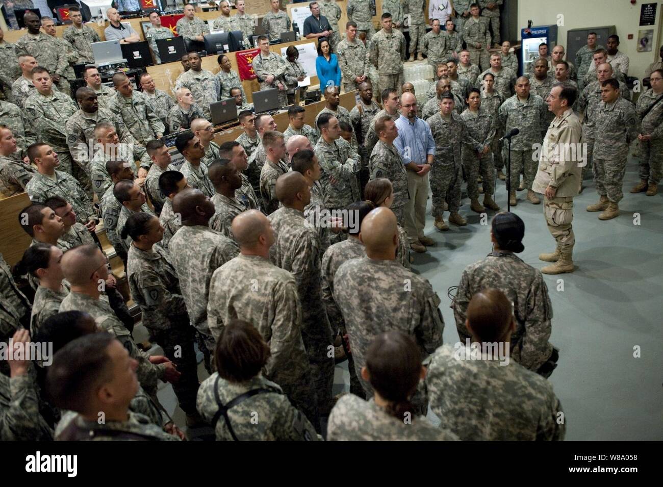 Chairman of the Joint Chiefs of Staff Adm. Mike Mullen conducts an all hands call with service members assigned to the 25th Infantry Division at the U.S. Division Center at Camp Liberty, Iraq, on April 22, 2011.  Mullen is in the Central Command area of operation supporting a USO tour to the region and talking to counterparts and service members stationed in the area. Stock Photo