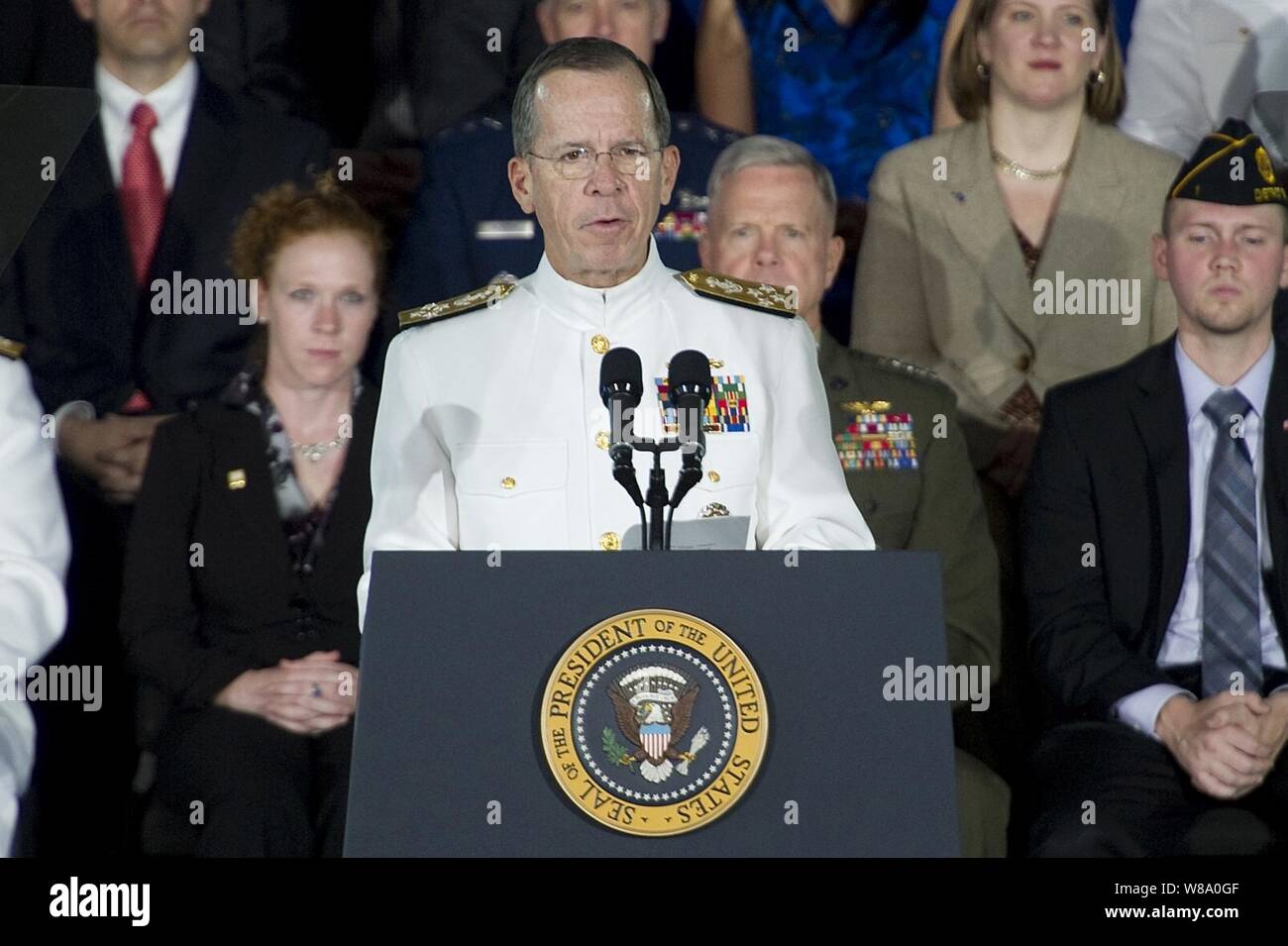 Chairman of the Joint Chiefs of Staff Adm. Mike Mullen introduces President of the United States Barack Obama at the Washington Navy Yard on Aug. 5, 2011.  Obama delivered remarks on the administration's initiative to help America's veterans find employment. Stock Photo