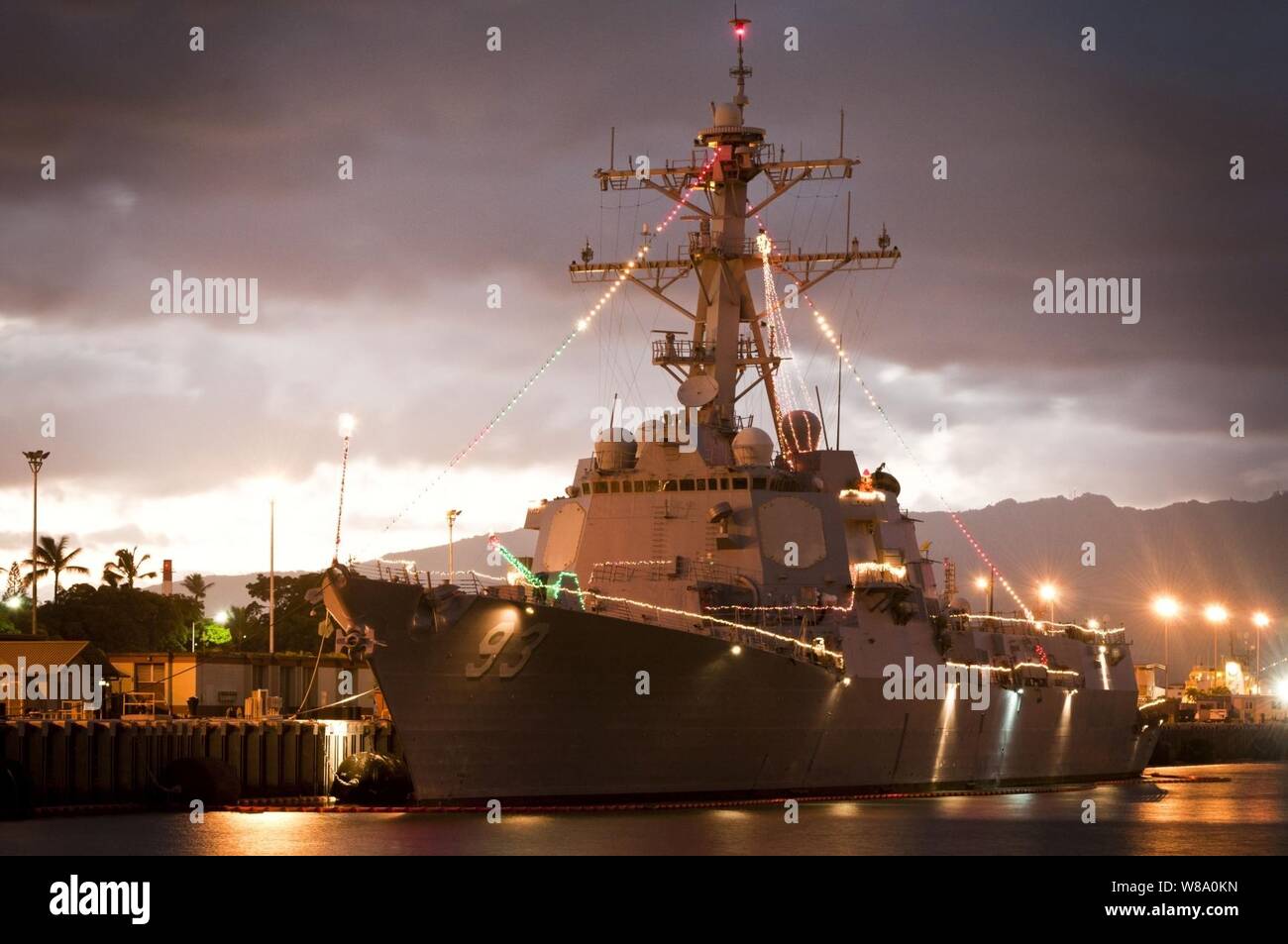 he guided-missile destroyer USS Chung-Hoon (DDG 93) is decorated with Christmas lights at Joint Base Pearl Harbor-Hickam on Dec. 21, 2011. Stock Photo