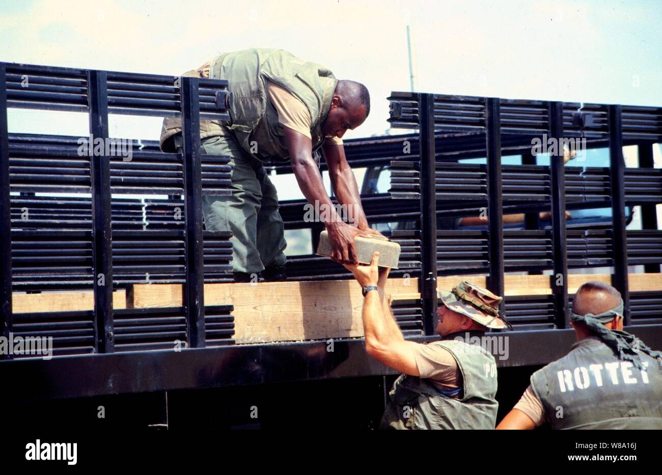 Marine Barracks Minefield Maintenance personnel unload deactivated anti-tank and anti-personnel land mines for destruction at a demolition site on Naval Station Guantanamo Bay, Cuba, in this March 18, 1997, file photo.  Anti-personnel and anti-tank land mines on the U.S. side of the fence separating Communist Cuba and the U.S. Naval Base at Guantanamo Bay are being removed in accordance with the Presidential Order of May 16, 1996.  Approximately 50,000 land mines were placed in the buffer zone between Communist Cuba and Guantanamo Bay beginning in 1961 as a result of the Cold War. The land min Stock Photo