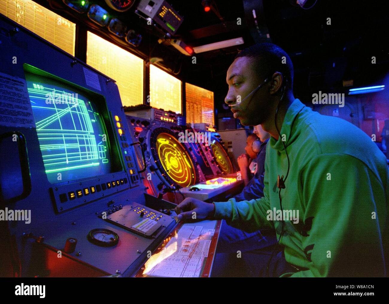 Petty Officer 2nd Class Buccie Cline, a Navy air traffic controlman, monitors final control positions of pilots during flight operations from the aircraft carrier USS Nimitz (CVN 68) on Nov. 16, 1997.  The Nimitz and embarked Carrier Air Wing 9 are operating in the Persian Gulf in support of Operation Southern Watch which is the U.S. and coalition enforcement of the no-fly-zone over Southern Iraq. Cline is from Humphrey, Ariz. Stock Photo