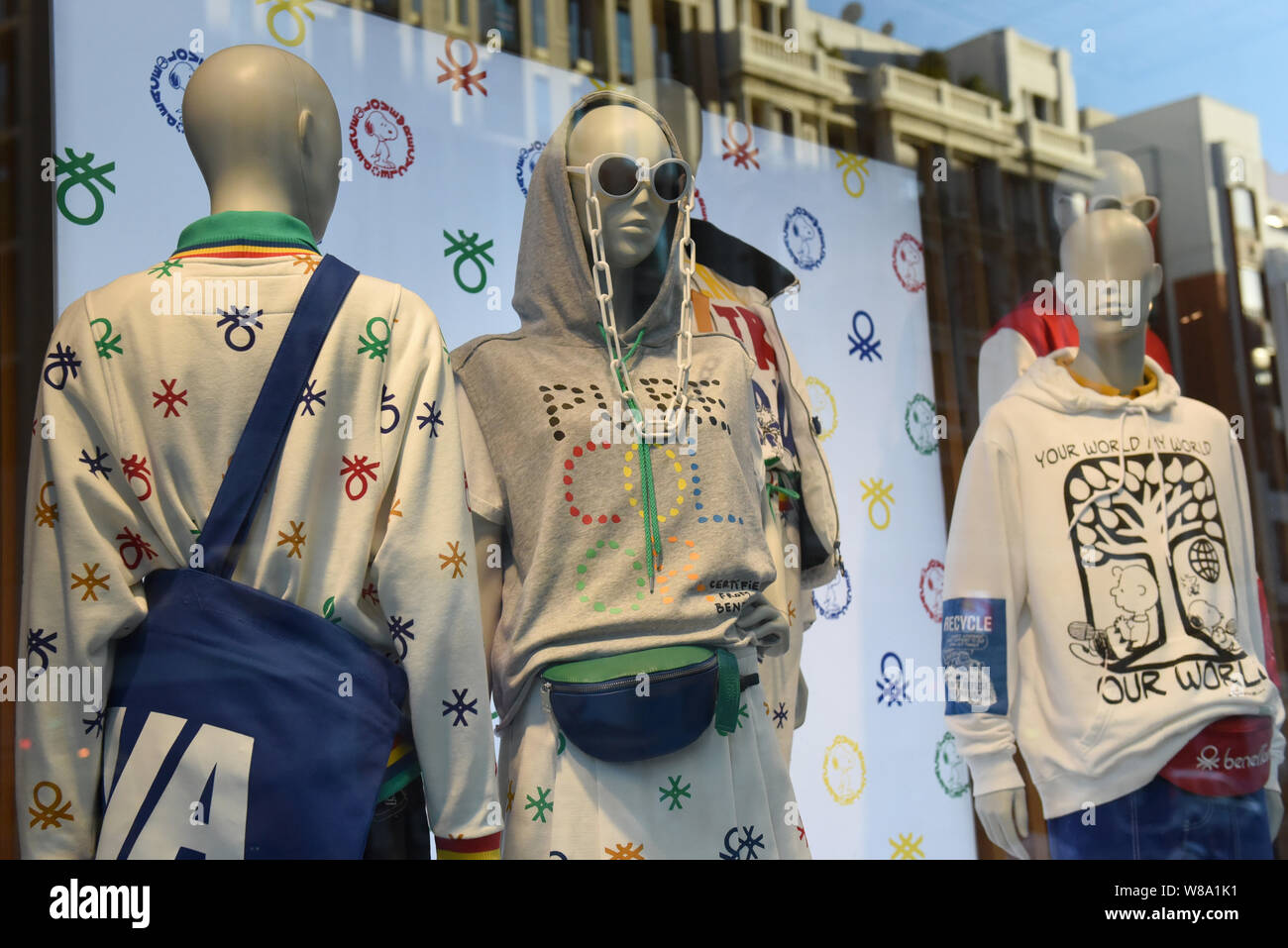 Dummies seen through the United Colors of Benetton shop window on Gran Via Street in Madrid. Stock Photo