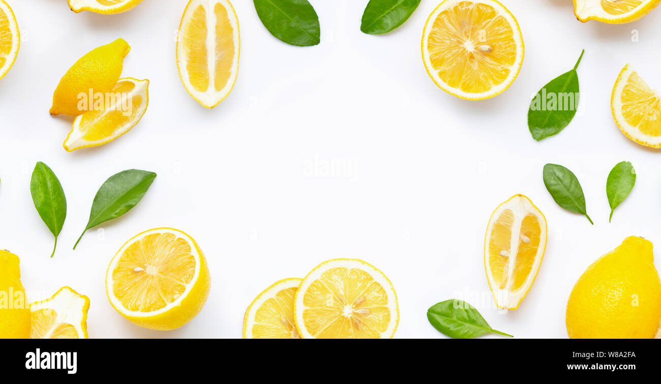 Frame made of fresh lemon and slices with leaves isolated on white ...