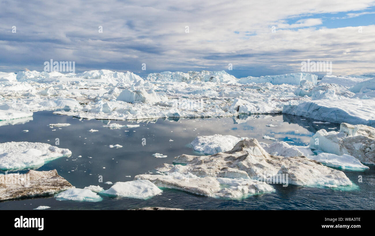Greenland Iceberg Landscape Of Ilulissat Icefjord With Giant Icebergs greenland-iceberg-landscape-of-ilulissat-icefjord-with-giant-icebergs