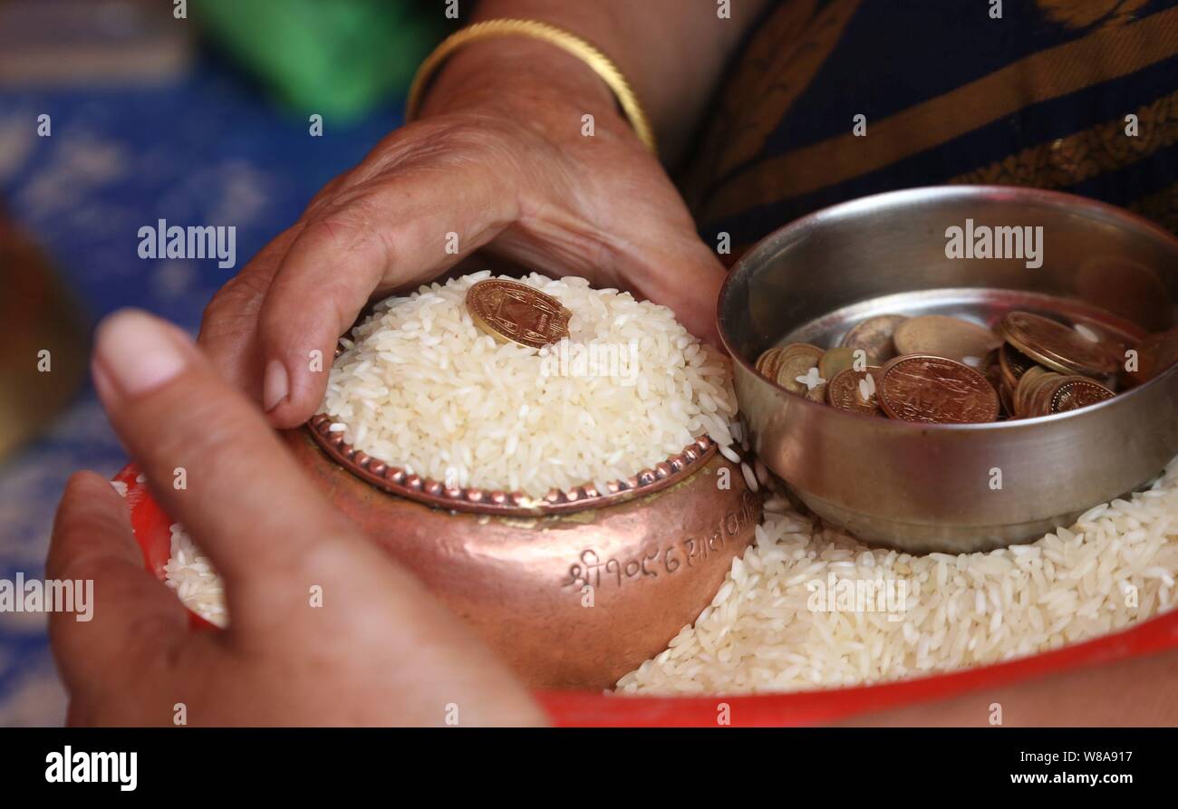 Lalitpur, Nepal. 08th Aug, 2019. A Buddhist prepares offerings for distribution during Pancha Dan festival in Lalitpur, Nepal. (Photo by Archana Shrestha/Pacific Press) Credit: Pacific Press Agency/Alamy Live News Stock Photo