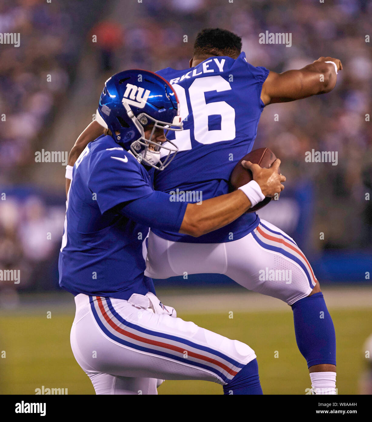 New York, USA. August 8, 2019, East Rutherford, New Jersey, USA: New York  Giants quarterback Daniel Jones (8) celebrates with running back Saquon  Barkley (26) after throwing his first touchdown pass during