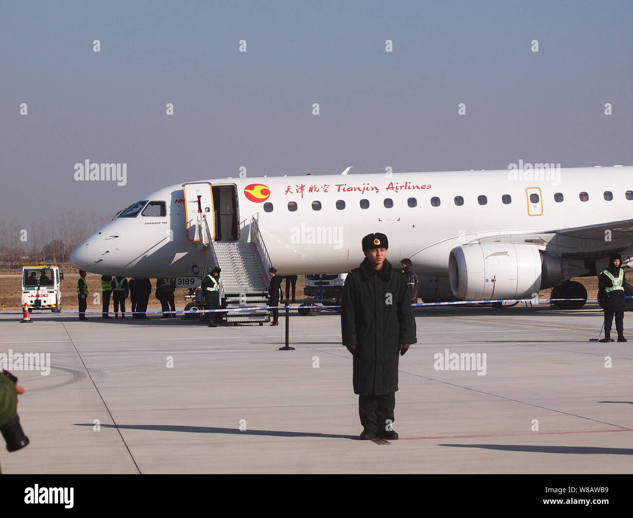 --FILE--View of a jet plane of Tianjin Airlines at the Linfen Qiaoli Airport in Linfen city, north China's Shanxi province, 25 January 2016.   An ambi Stock Photo