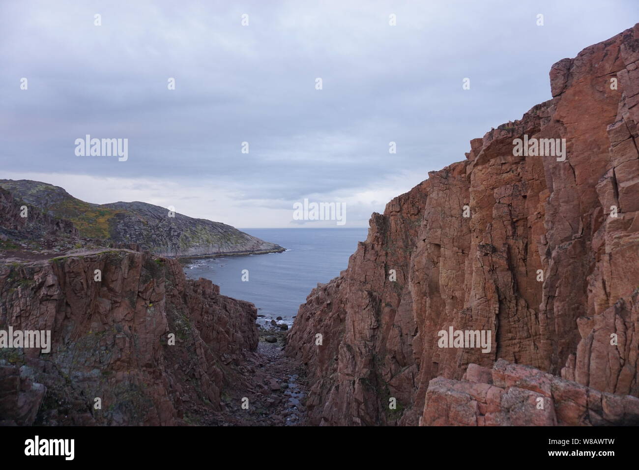 The view of rocky hill facing the sea in Teriberka, Russia. Stock Photo