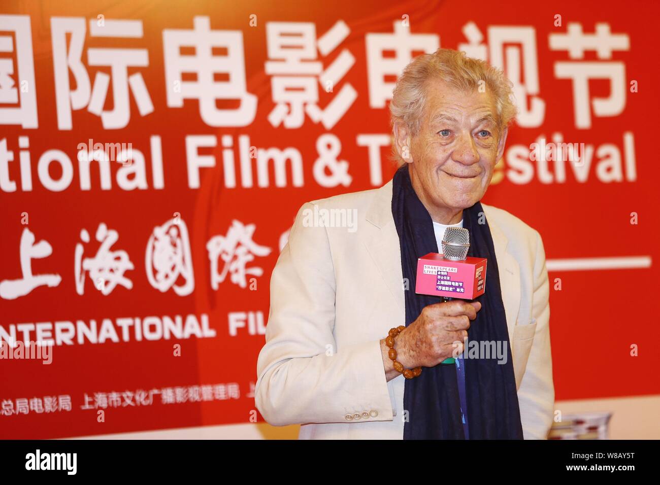 English actor Sir Ian McKellen listens to a question at a press conference to promote the British Council's 'Shakespeare Lives' program during the 19t Stock Photo