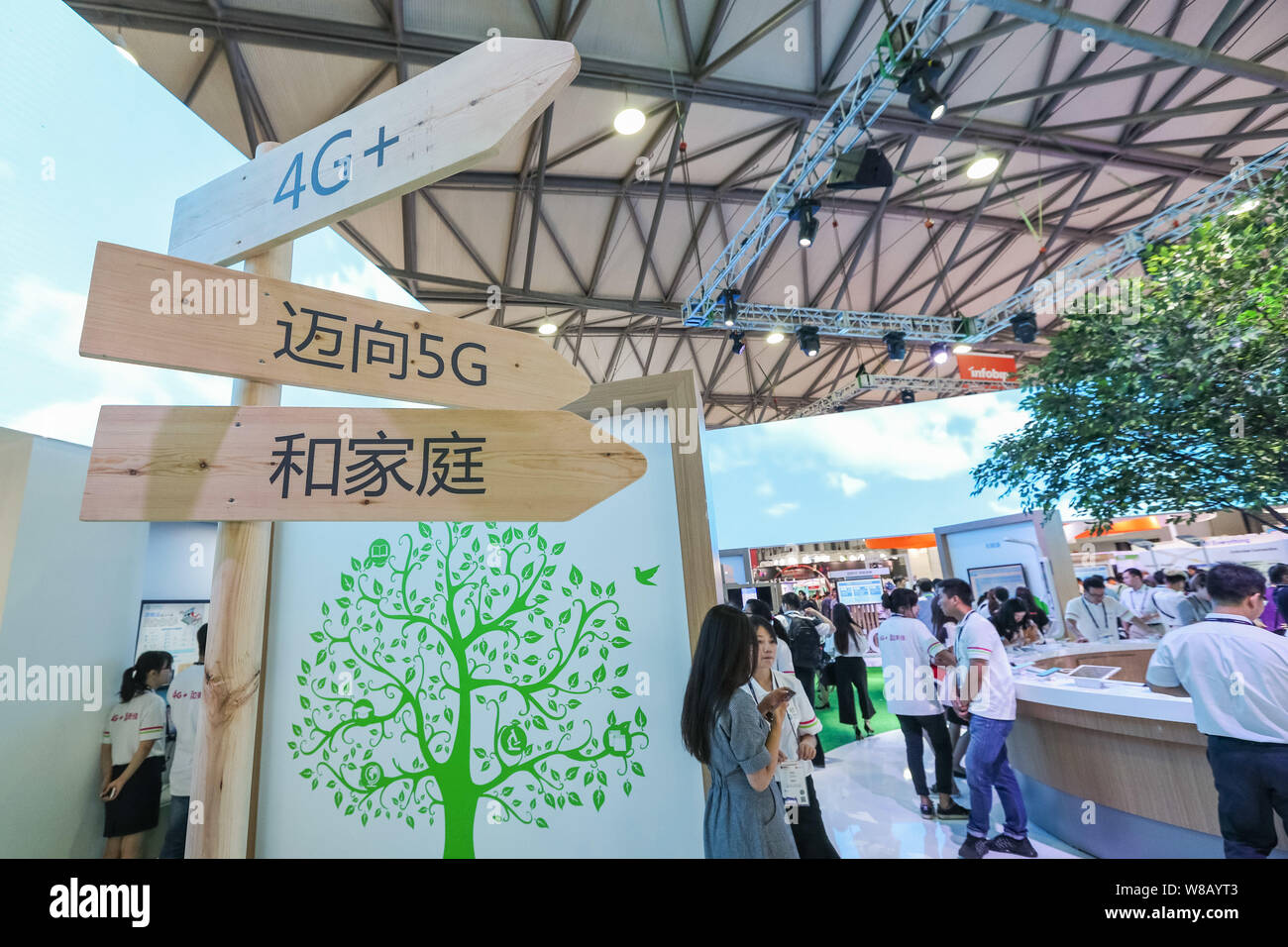 Signboards of 4G+ and 5G networks are display at the stand of ZTE during the 2016 Mobile World Congress (MWC) in Shanghai, China, 29 June 2016.   Give Stock Photo