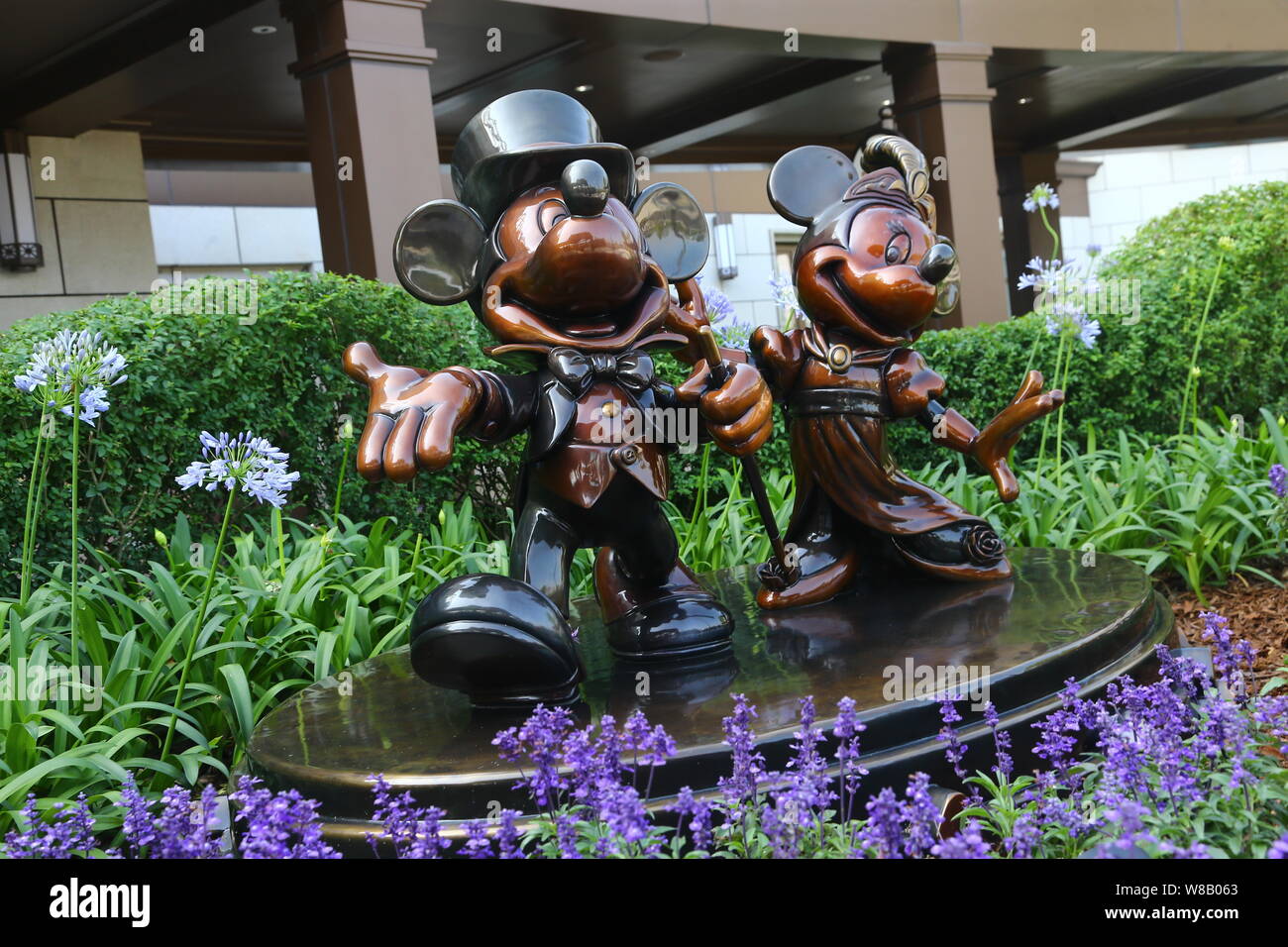 Statues Of Mickey Mouse And Minnie Mouse Are Displayed Outside The