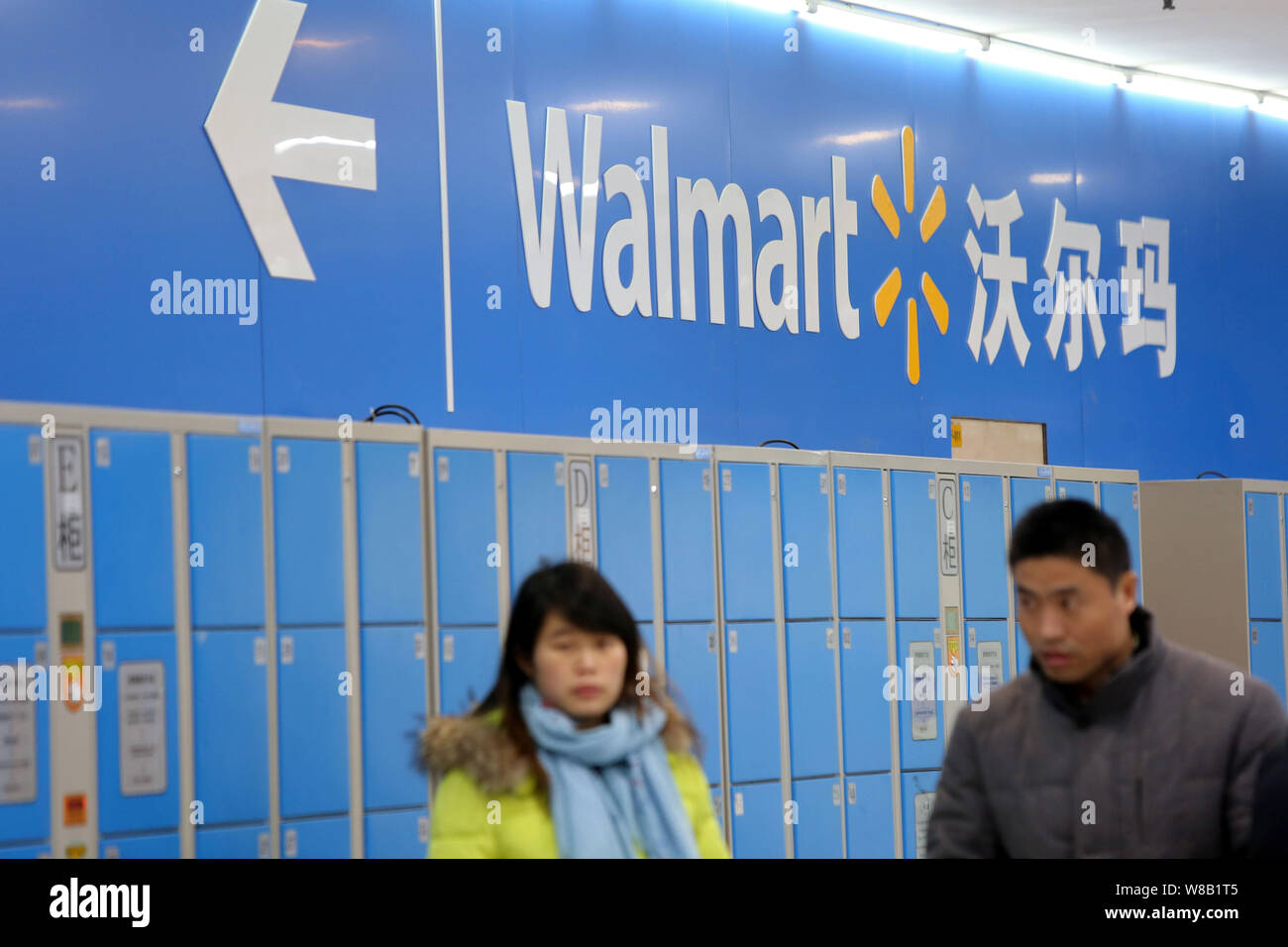 FILECustomers walk in a Walmart supermarket in Shanghai, China, 18