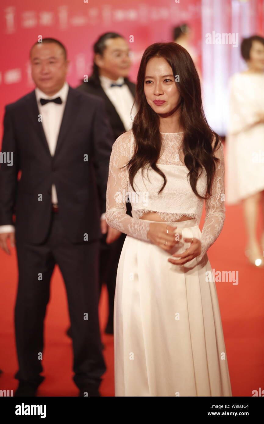 South Korean Actress Cheon Seong Im Second Left Better Known By Her Stage Name Song Ji Hyo Arrives On The Red Carpet For The Opening Ceremony Of Th Stock Photo Alamy