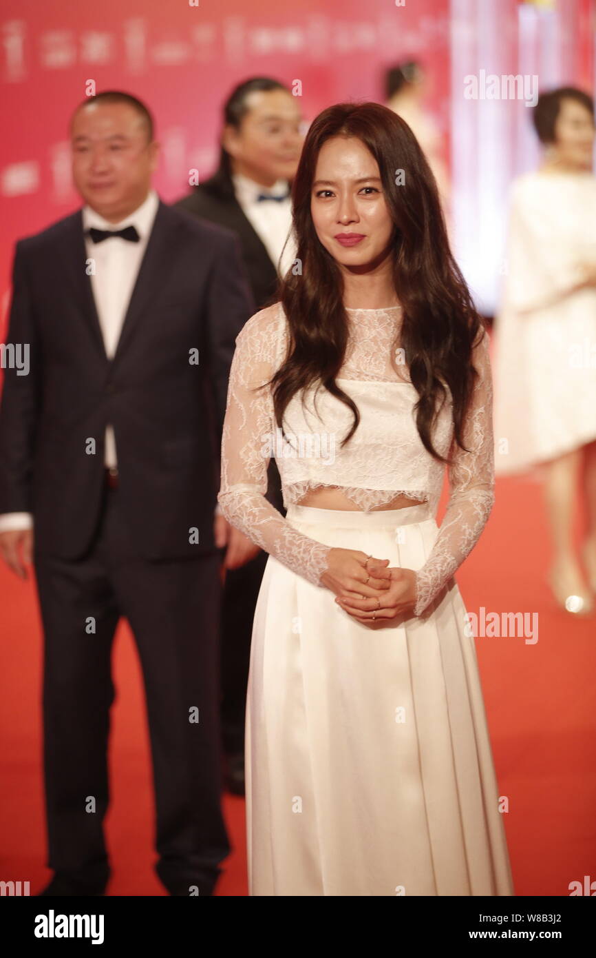 South Korean Actress Cheon Seong Im Second Left Better Known By Her Stage Name Song Ji Hyo Arrives On The Red Carpet For The Opening Ceremony Of Th Stock Photo Alamy