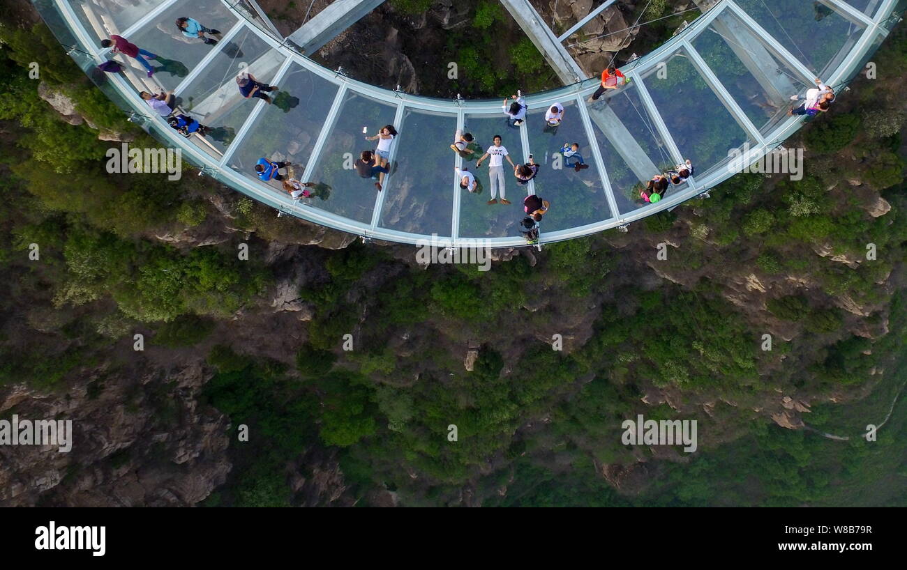 Tourists visit the glass sightseeing platform in the Shilinxia scenic spot  in Beijing, China, 30 April 2016. Spanning a length of 32.8 meters and ta  Stock Photo - Alamy