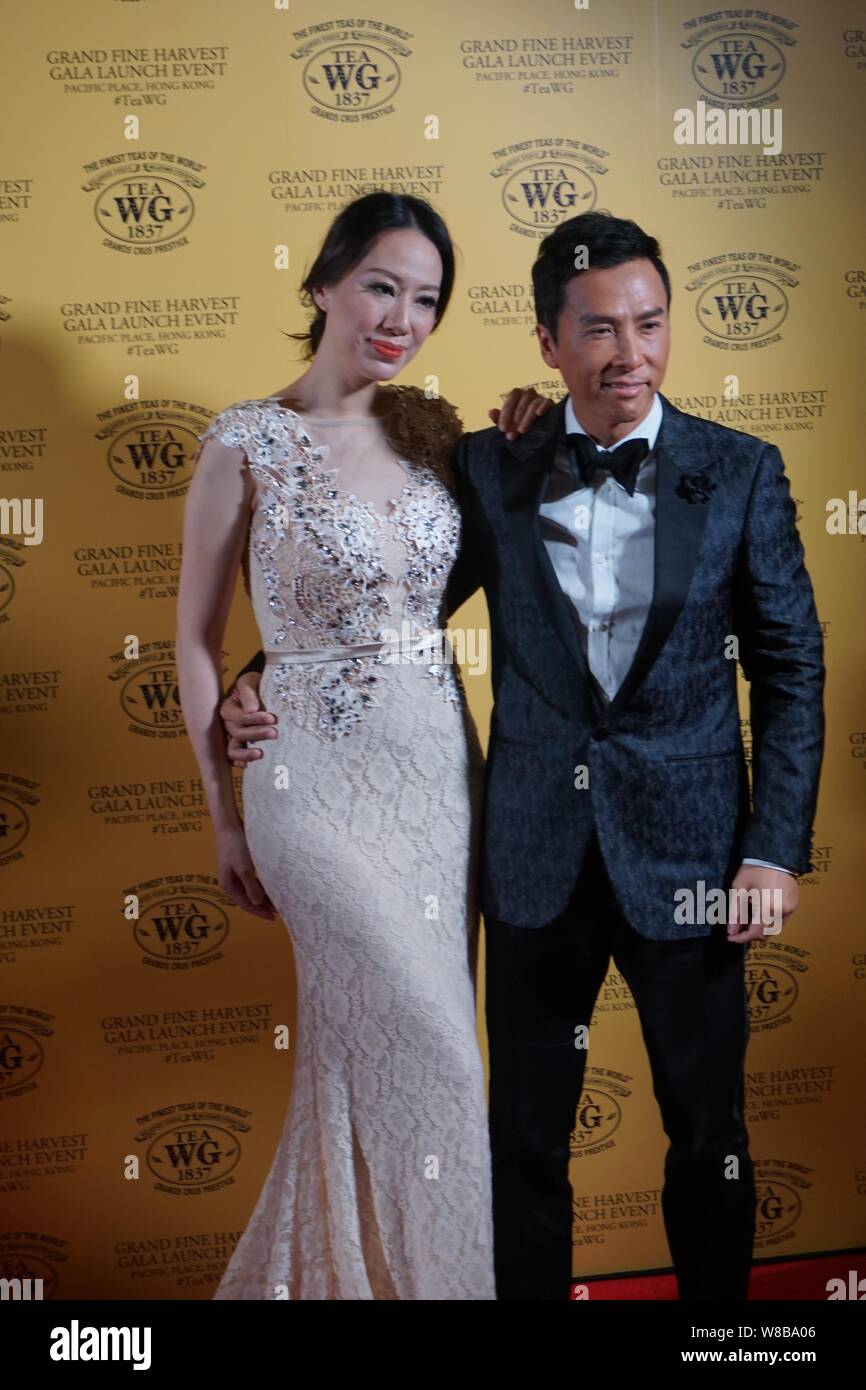Hong Kong actor Donnie Yen, right, and his model wife Cecilia Wang pose on  the red carpet as they arrive for a grand fine harvest gala launch event by  Stock Photo -