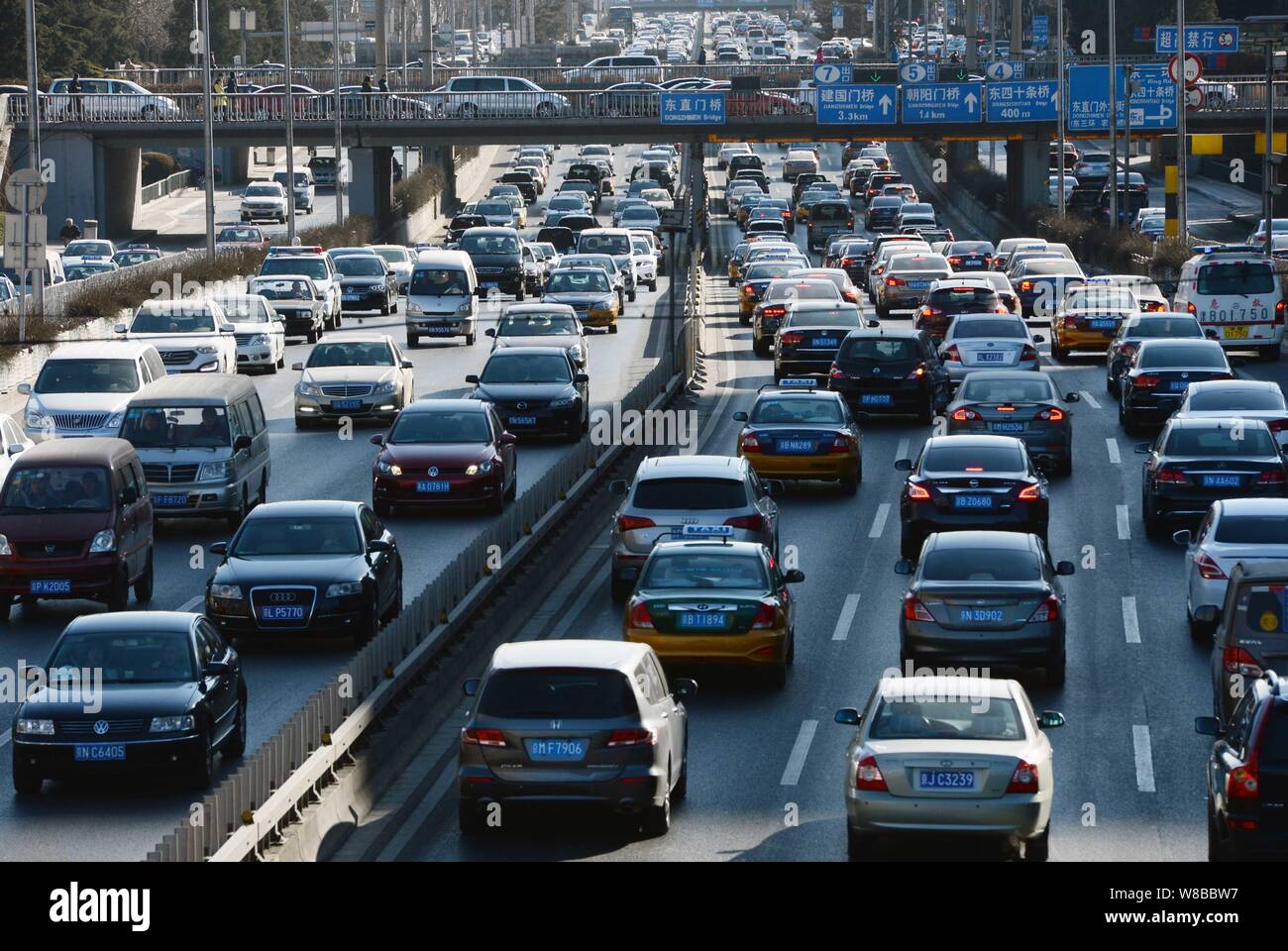 --FILE--Vehicles move slowly in a traffic jam on a street in Beijing, China, 1 February 2016.   Beijing has preliminarily worked out policies on conge Stock Photo