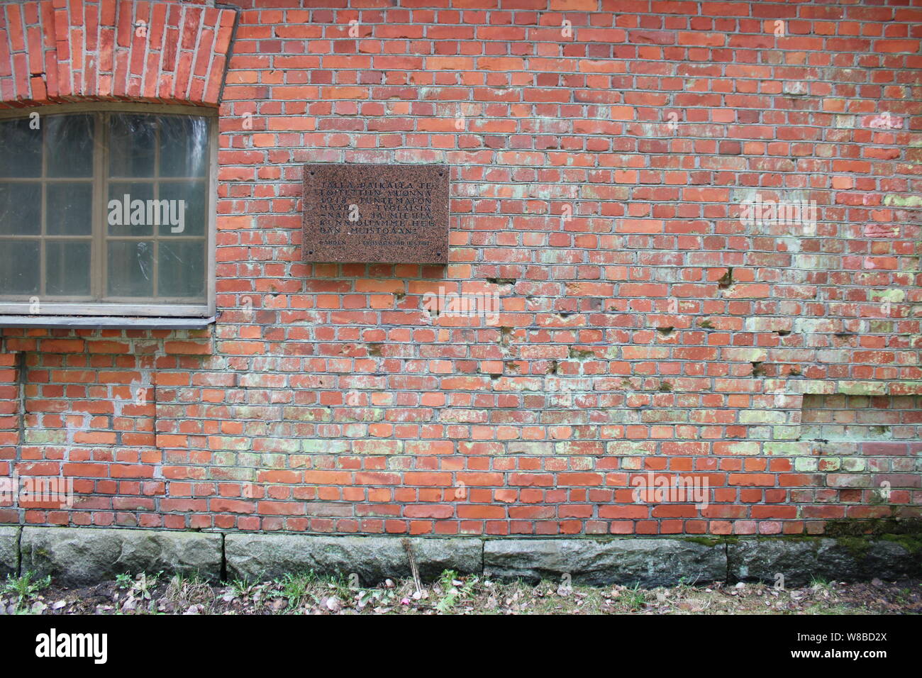 Finnish civil war era execution site wall with bullet holes and a plaque in Lahti, Finland. Stock Photo