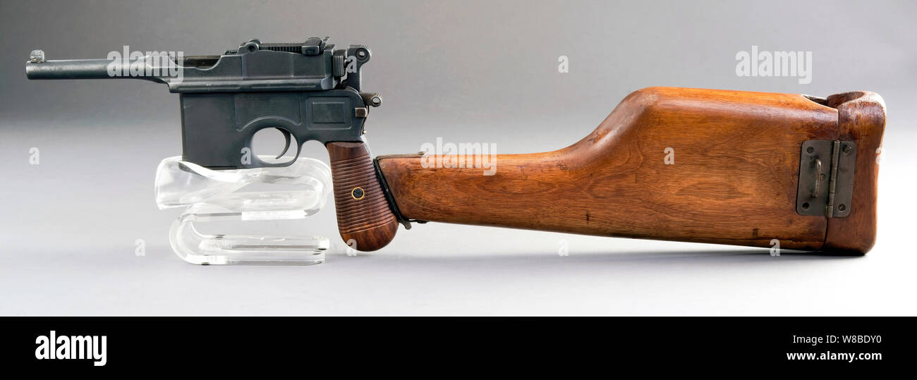 Antique German broomhandle pistol made around 1926 with attached wooden shoulder stock. Stock Photo