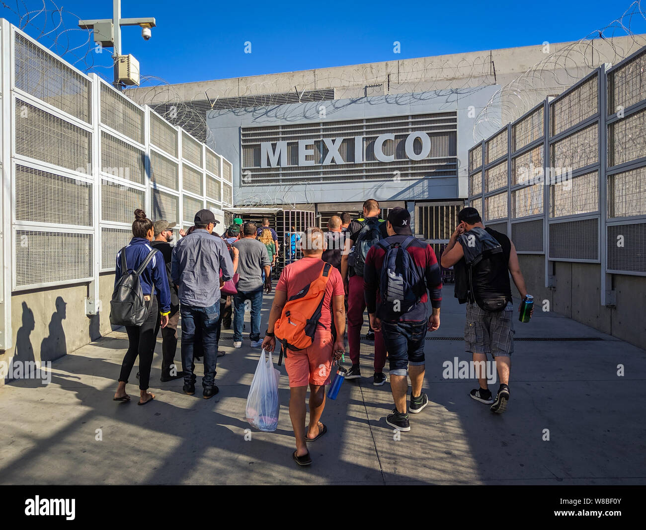 Pedestrians at the PedEast U.S./Mexican border crossing in San Diego, California. Stock Photo