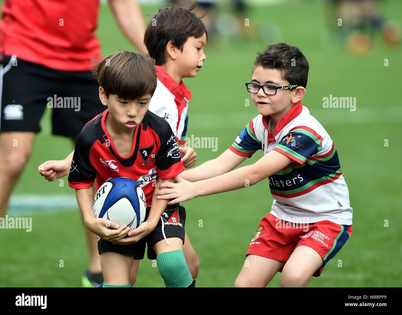 Young kids compete in a rugby game during the Hong Kong Sevens 2016 in Hong Kong, China, 8 April 2016. Stock Photo