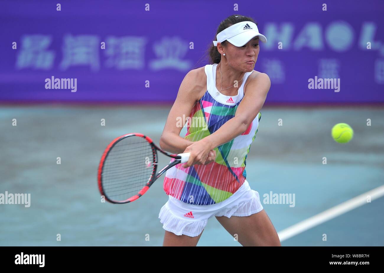 Xu Shilin of China returns a shot to Riko Sawayanagi of Japan in their  women's singles match during the 2016 ITF Women's Circuit - Nanning in  Nanning Stock Photo - Alamy