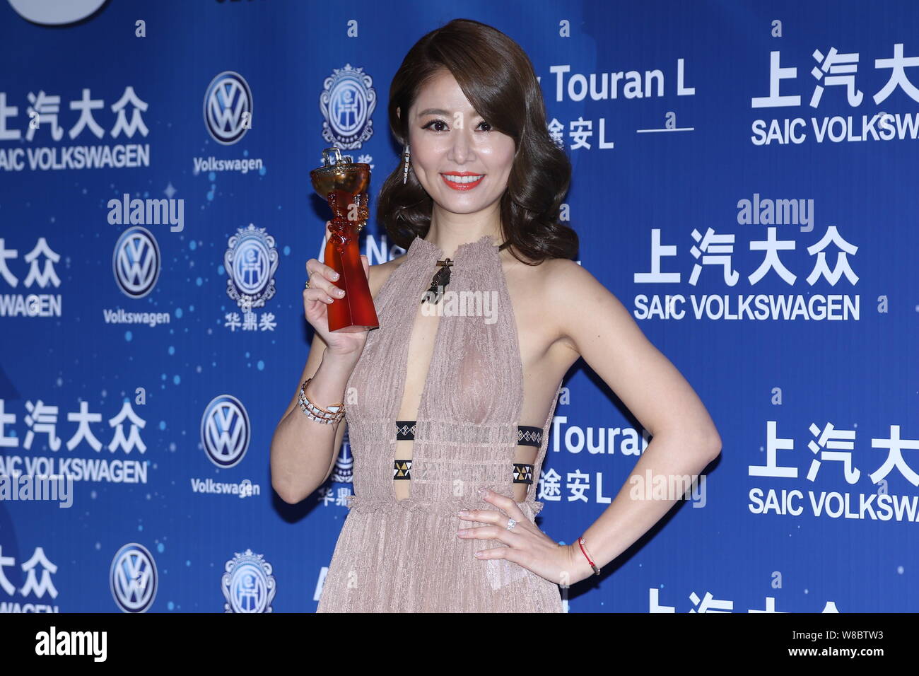 Taiwanese actress Ruby Lin poses with her trophy for the Best Actress ...