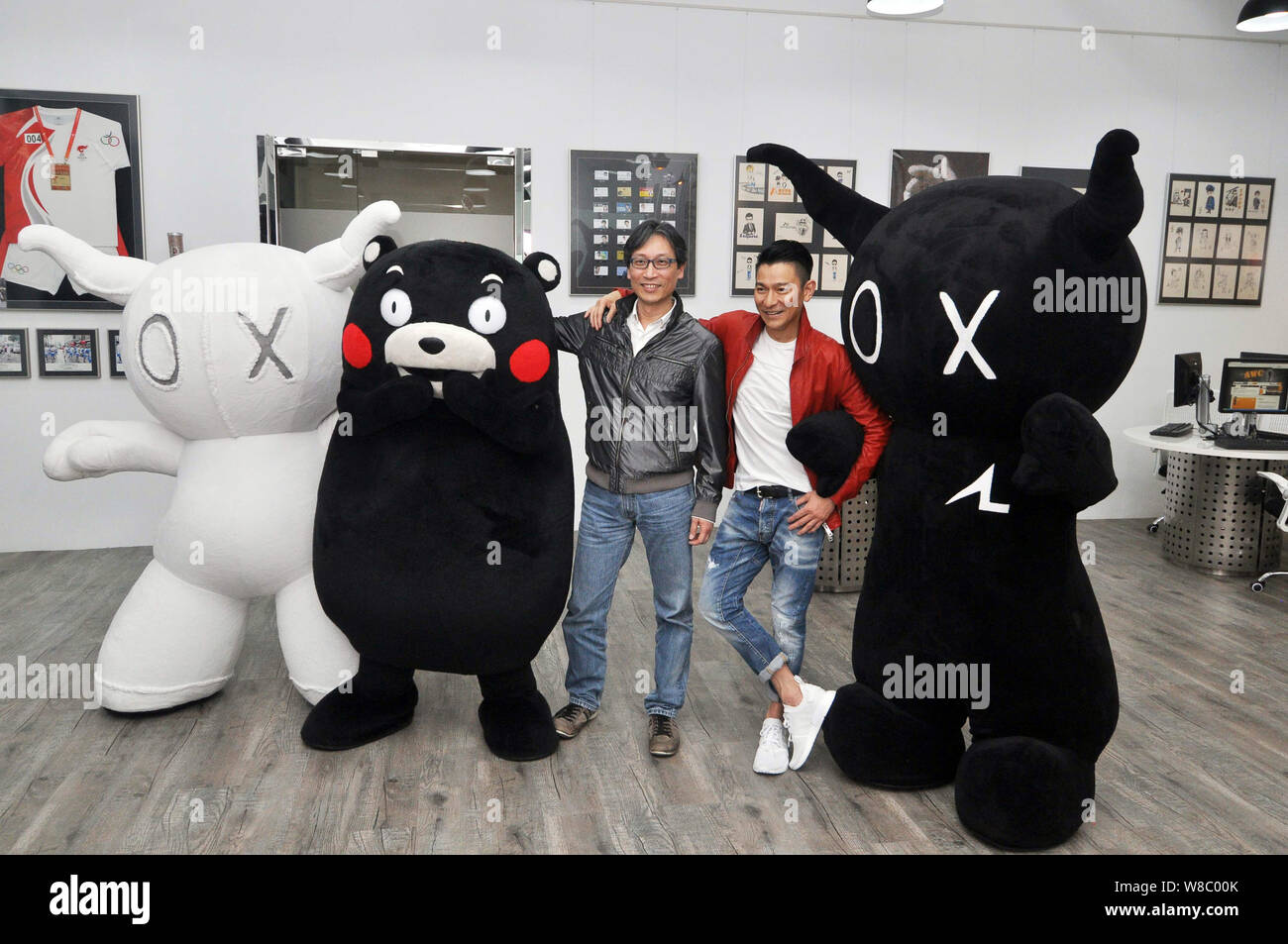 In this handout picture, Hong Kong singer and actor Andy Lau, second ...
