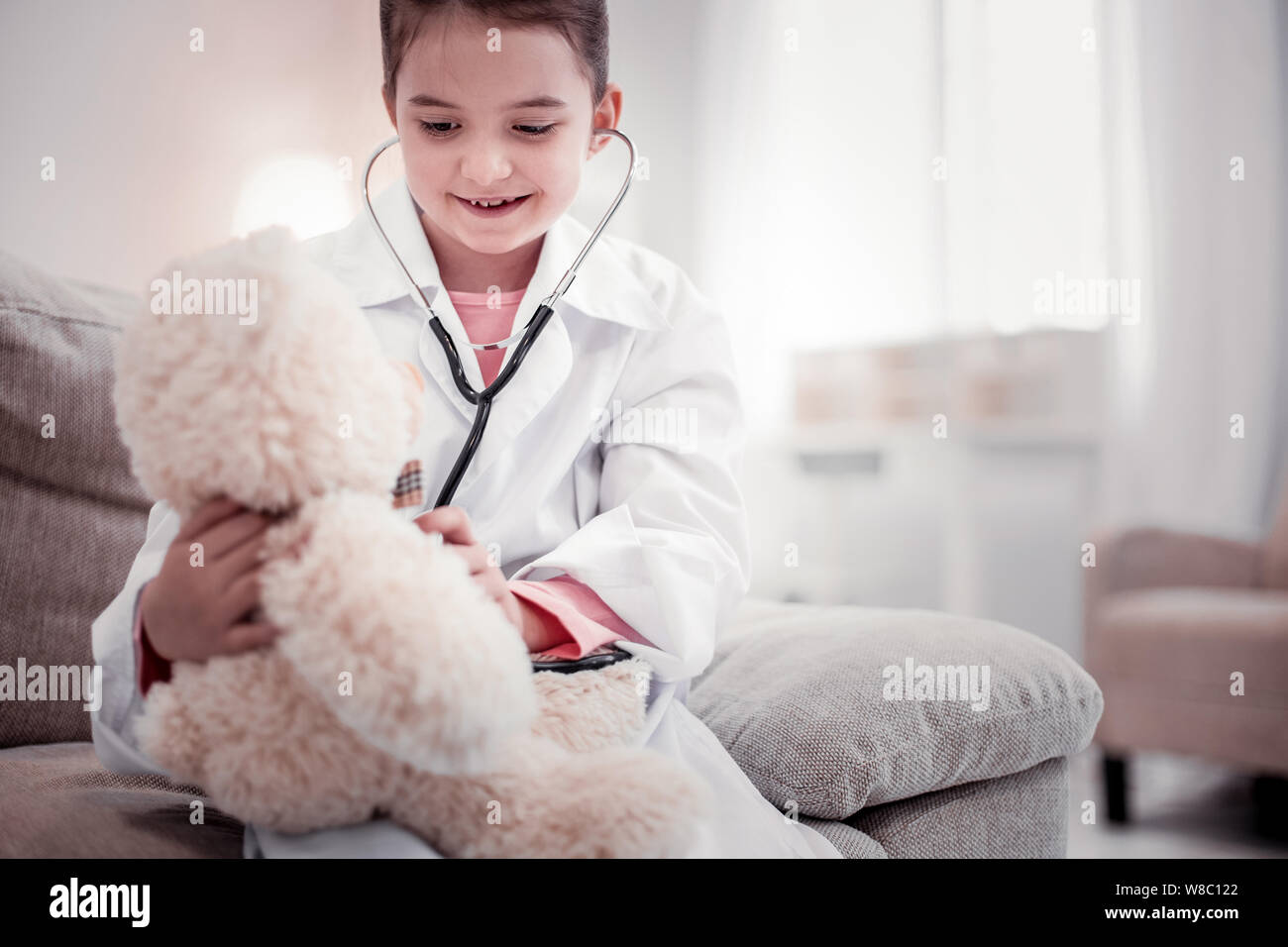 Girl doctor using stethoscope hi-res stock photography and images - Alamy