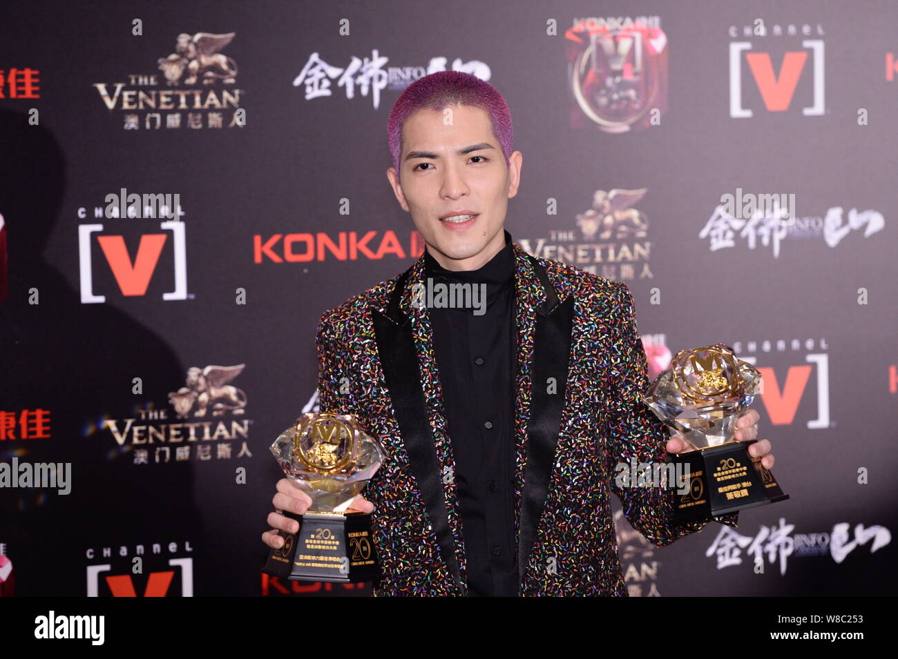 Taiwanese singer Jam Hsiao poses with his trophies after the 20th China Music Awards ceremony in