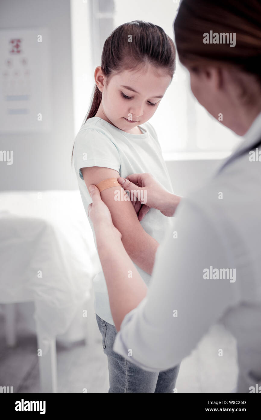 Pretty nice young girl visiting a hospital Stock Photo