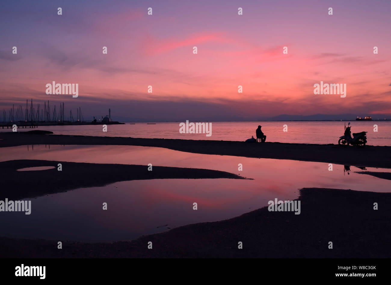 Beach After Rian Scene in beach after rain with silhouettes of sails, a chapel,a man ...