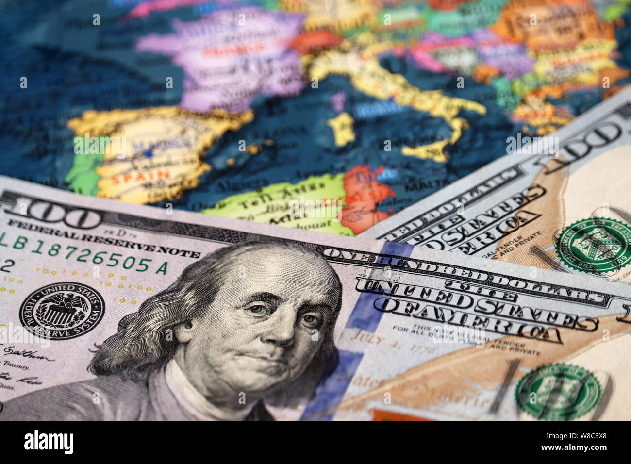 US dollars on the map of Europe. Concept of trade between the United States and Europe, exchange rate, tourism Stock Photo