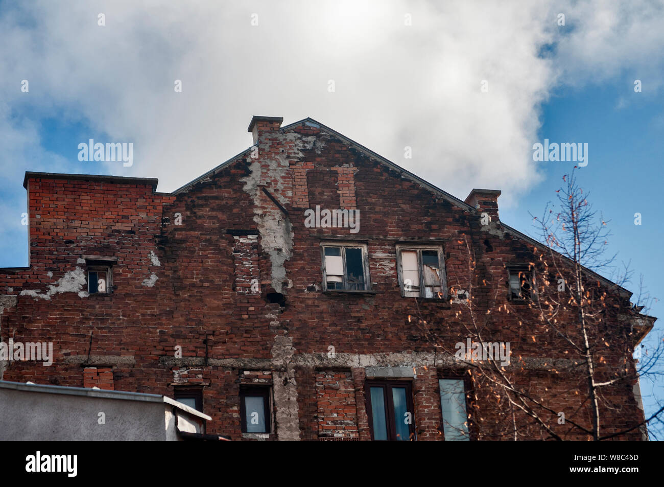 Backside old weathered vintage brick building wall facade Stock Photo