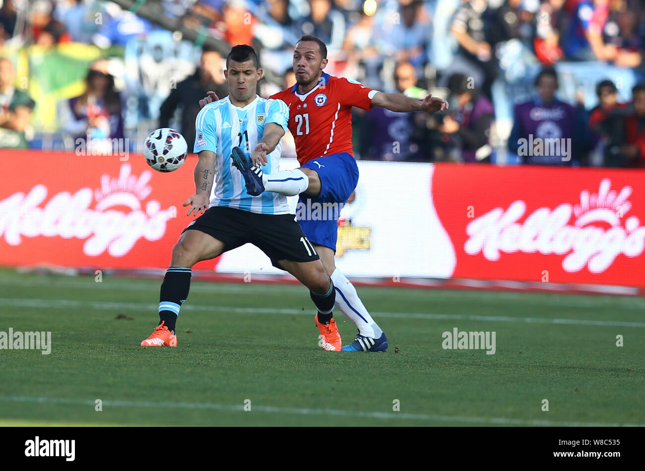 Argentina's Sergio Aguero, left, challenges Chile's Marcelo Diaz, right, during the Copa America 2015 final soccer match between Chile and Argentina a Stock Photo