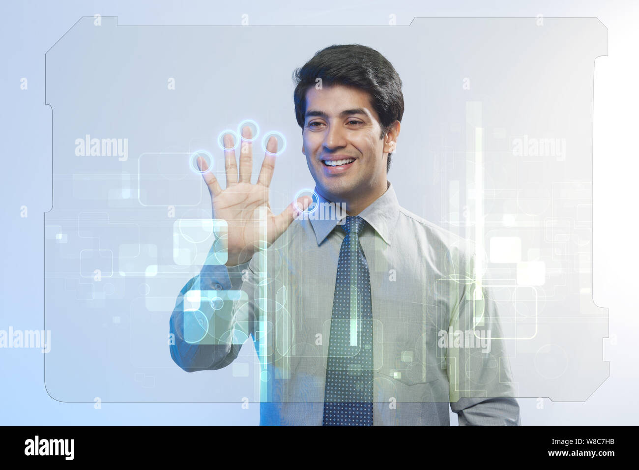 Businessman using a touch screen for biometrics identification Stock Photo