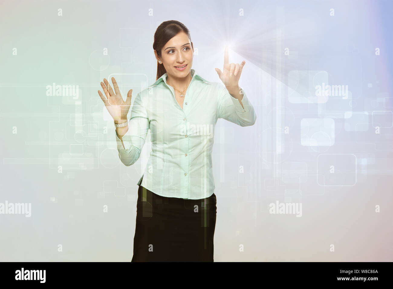 Businesswoman using futuristic touch screen Stock Photo