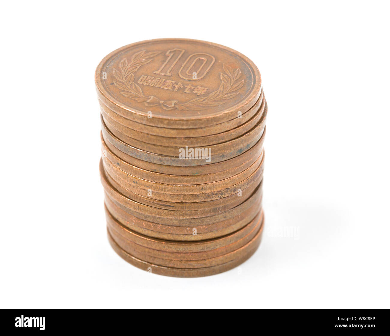 Pile of 10 yen coins japanese money, close up on white background Stock
